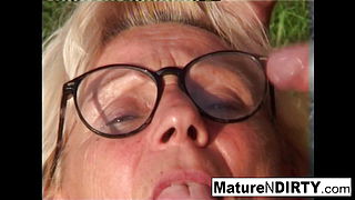 Blonde grandma gets some cum on her glasses